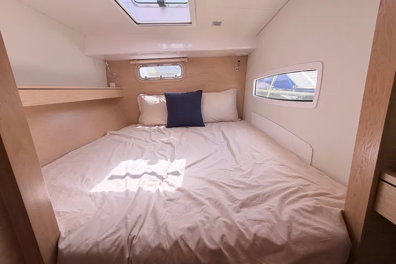 Slide: The Image of Cozy cabin interior of 2016 Outremer 45 yacht with bed and window. - 71