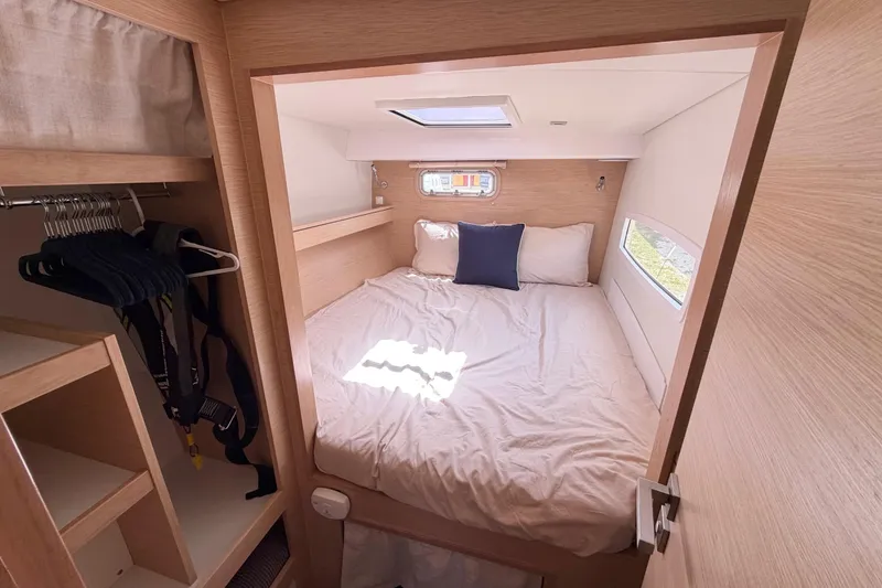 Slide: The Image of Cozy cabin interior of 2016 Outremer 45 catamaran with bed and storage. - 72