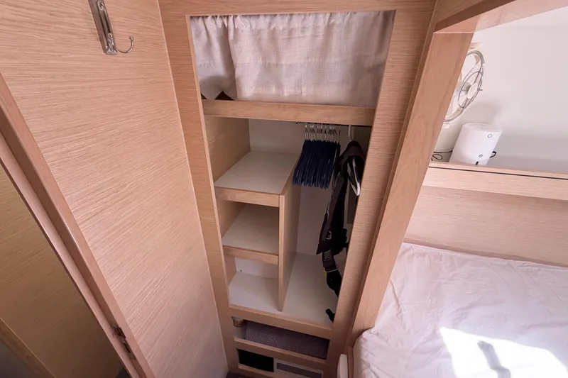 Slide: The Image of Interior of 2016 Outremer 45 yacht showing wooden wardrobe and storage space. - 74