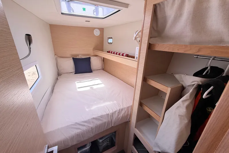 Slide: The Image of Cozy cabin interior of 2016 Outremer 45 yacht with bed and storage space. - 79