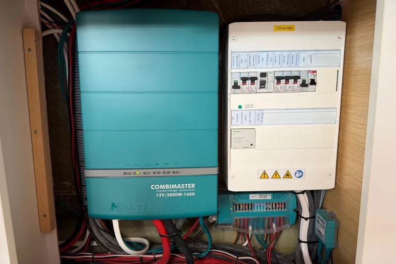 Slide: The Image of Electrical system of a 2016 Outremer 45, featuring a Mastervolt CombiMaster inverter. - 83