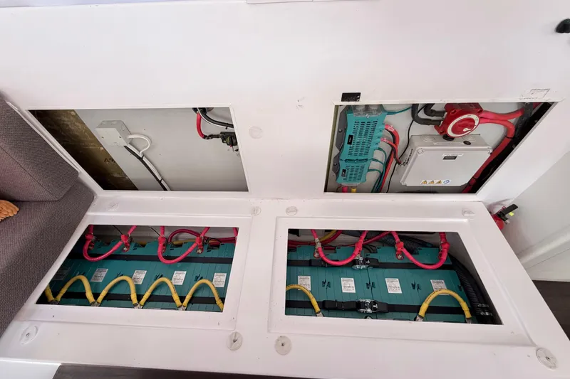 Slide: The Image of Electrical system and battery compartment of a 2016 Outremer 45 catamaran. - 84