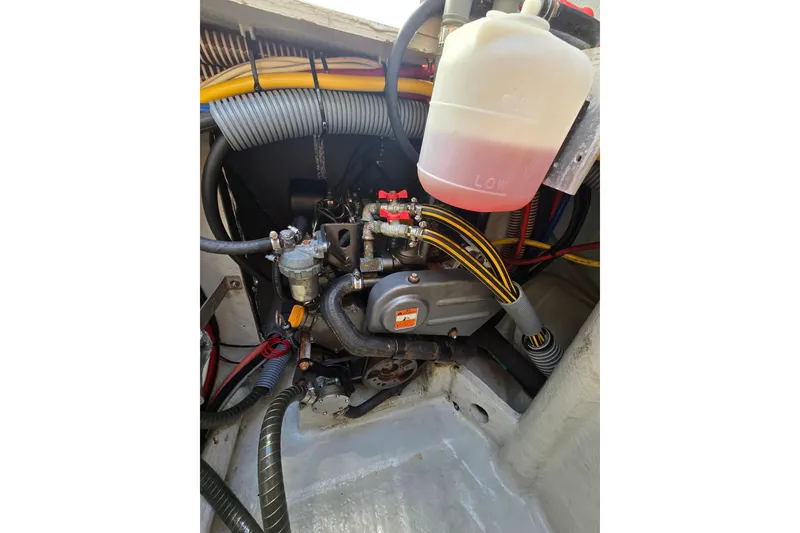 Slide: The Image of Engine compartment of a 2016 Outremer 45 catamaran, showcasing wiring and components. - 87