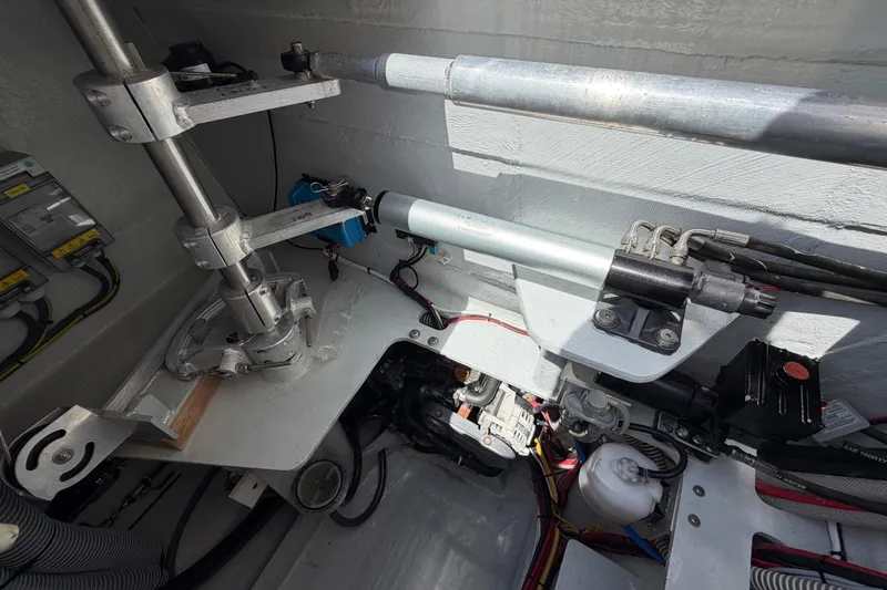 Slide: The Image of Interior mechanical components of a 2016 Outremer 45 catamaran, showcasing steering and hydraulic systems. - 92