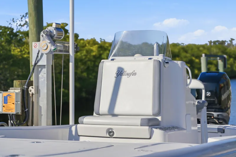 Slide: The Image of 2013 Yellowfin 24 Bay boat wiring and plumbing components in the engine compartment. - 11