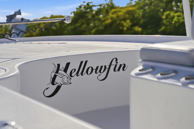Slide: The Image of 2013 Yellowfin 24 Bay boat docked by a scenic waterway. - 14