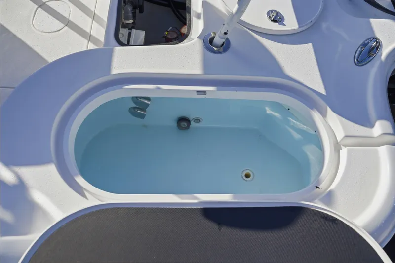 Slide: The Image of Livewell on a 2013 Yellowfin 24 Bay boat, showcasing fishing amenities. - 3
