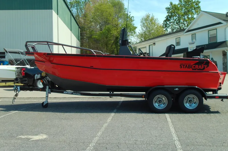 The Image of Red 2026 Stabicraft 2050 Frontier boat on trailer, parked outdoors. - 1