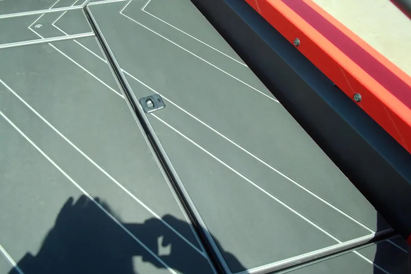 Slide: The Image of Stabicraft 2050 Frontier 2026 boat deck with geometric design and red trim. - 10