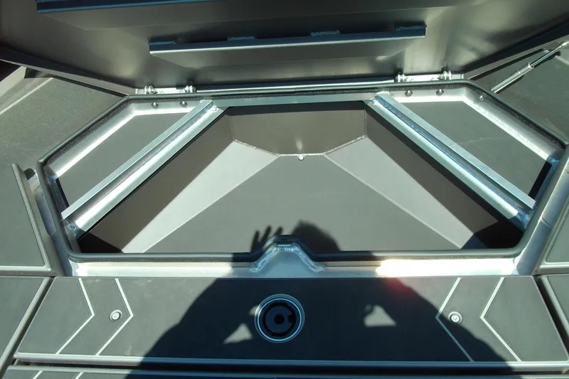 Slide: The Image of 2026 Stabicraft 2050 Frontier boat interior storage compartment with open hatch. - 12