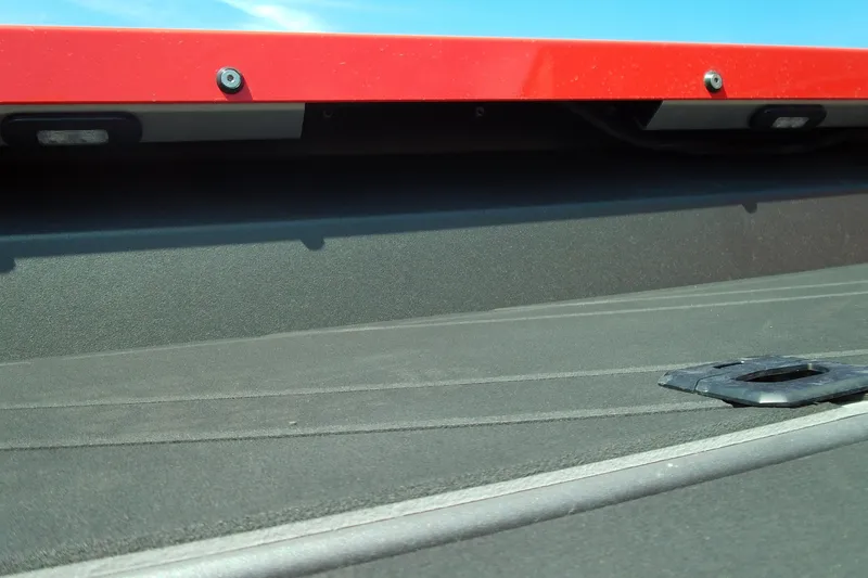 Slide: The Image of 2026 Stabicraft 2050 Frontier boat deck with red trim under blue sky. - 15