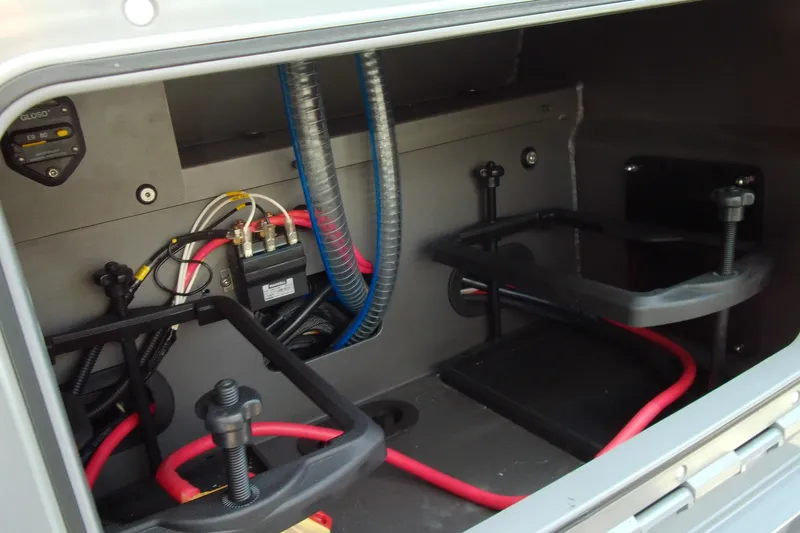 Slide: The Image of Electrical compartment of 2026 Stabicraft 2050 Frontier boat, featuring wiring and battery holders. - 22