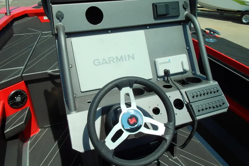 Slide: The Image of Stabicraft 2050 Frontier 2026 dashboard with Garmin navigation system and steering wheel. - 4