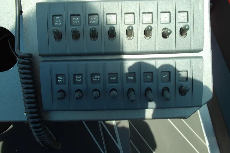 Slide: The Image of Control panel of 2026 Stabicraft 2050 Frontier boat with various switches. - 6