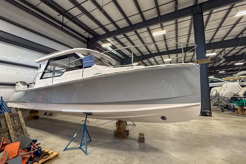Slide: The Image of 2024 True North 34 boat for sale in a showroom, side view. - 33