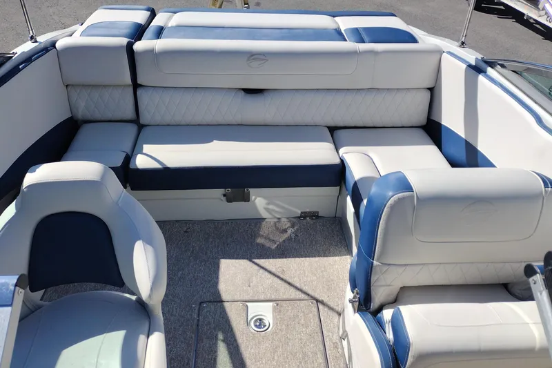Slide: The Image of Interior of a 2017 Crownline 225 SS boat with blue and white seating. - 12