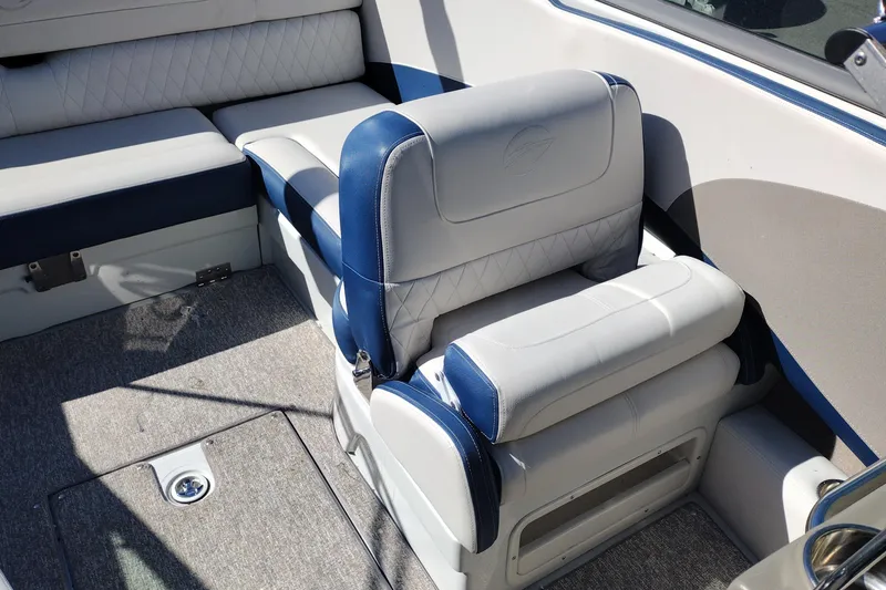 Slide: The Image of 2017 Crownline 225 SS boat interior with blue and white seating. - 13
