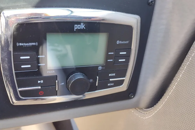 Slide: The Image of Polk audio system in 2017 Crownline 225 SS boat, featuring Bluetooth and SiriusXM capabilities. - 15