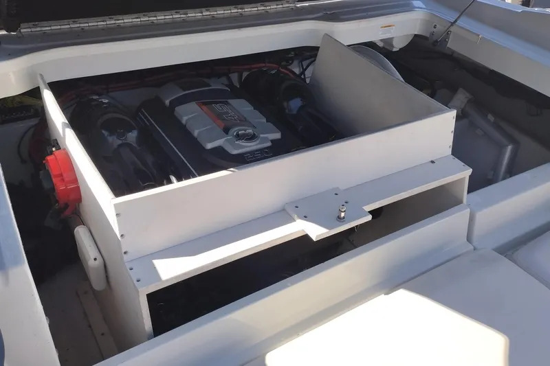 Slide: The Image of Engine compartment of a 2017 Crownline 225 SS boat, showcasing the motor and components. - 18