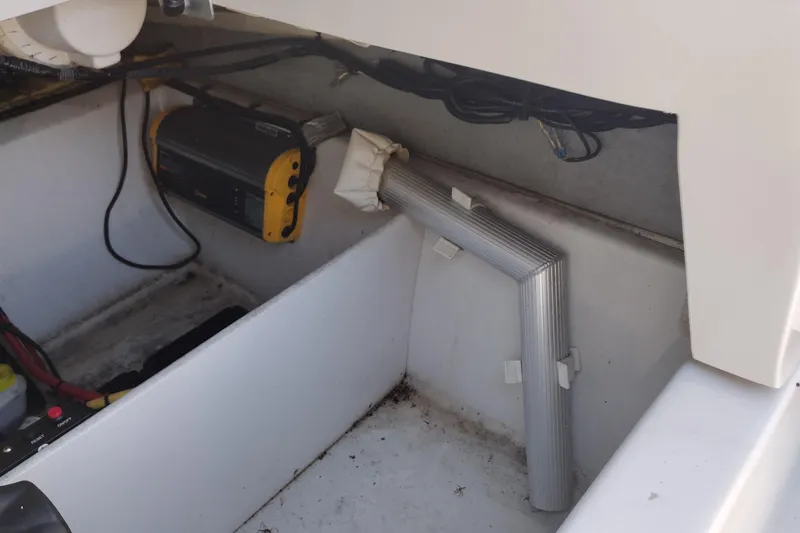 Slide: The Image of Interior view of a 2017 Crownline 225 SS boat showing electrical components and wiring. - 20