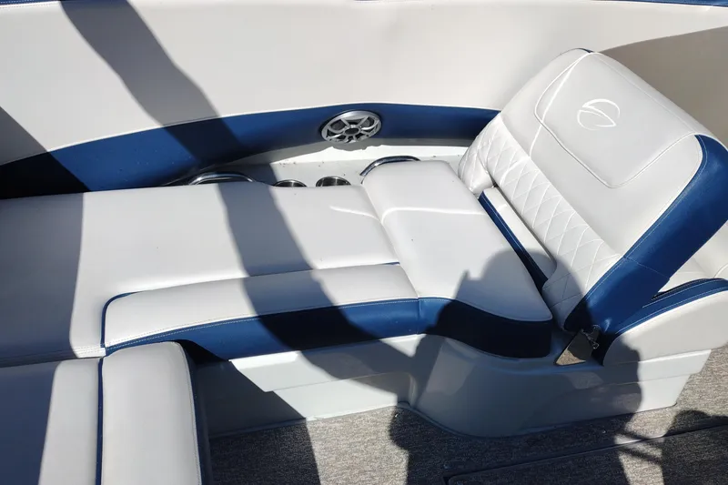 Slide: The Image of 2017 Crownline 225 SS boat interior with white and blue seating. - 22