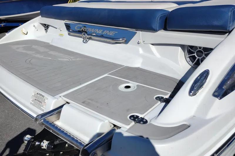 Slide: The Image of 2017 Crownline 225 SS boat stern with swim platform and seating. - 25