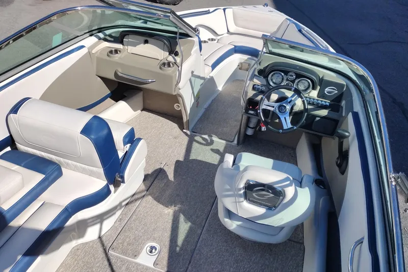 Slide: The Image of 2017 Crownline 225 SS boat interior with steering wheel and seating. - 7