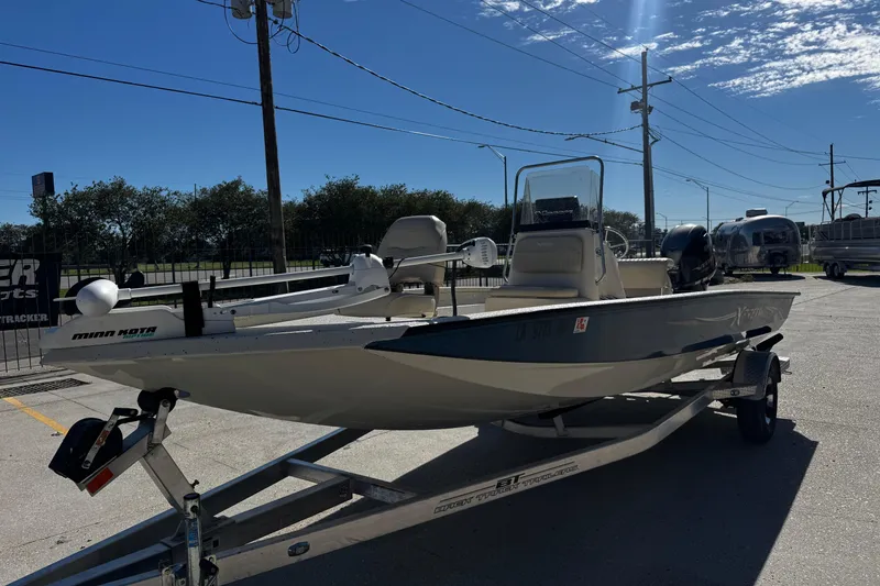 Slide: The Image of 2017 Xpress H20B Bay boat on trailer, equipped with Minn Kota trolling motor. - 7
