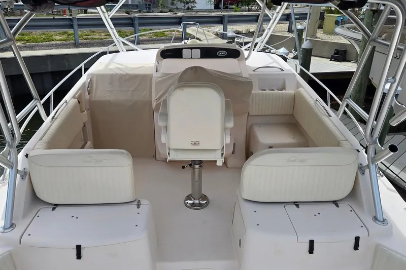 Slide: The Image of 2006 Grady-White Express 330 boat interior with white seating and helm station. - 10