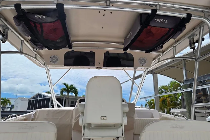 Slide: The Image of 2006 Grady-White Express 330 boat interior with seating and overhead storage. - 11