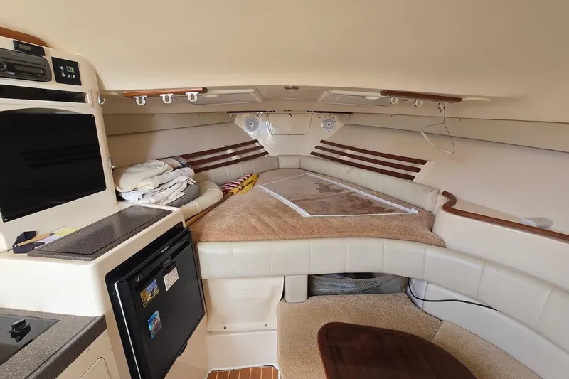 Slide: The Image of Interior of 2006 Grady-White Express 330 boat with cozy seating and modern amenities. - 15