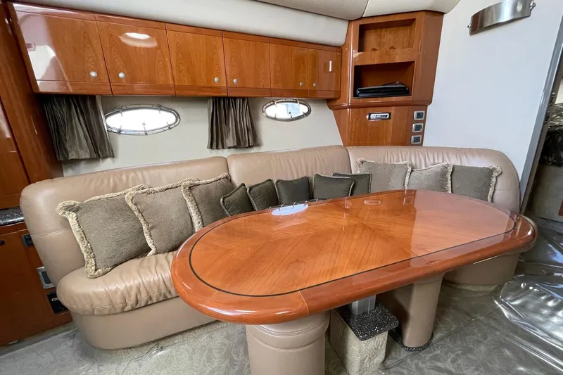 Slide: The Image of Luxurious interior of 2005 Formula 48 Yacht with plush seating and elegant wooden table. - 11