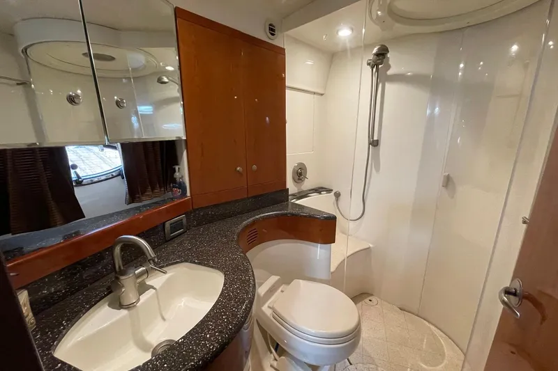 Slide: The Image of Luxurious bathroom in a 2005 Formula 48 Yacht, featuring modern fixtures and elegant design. - 19