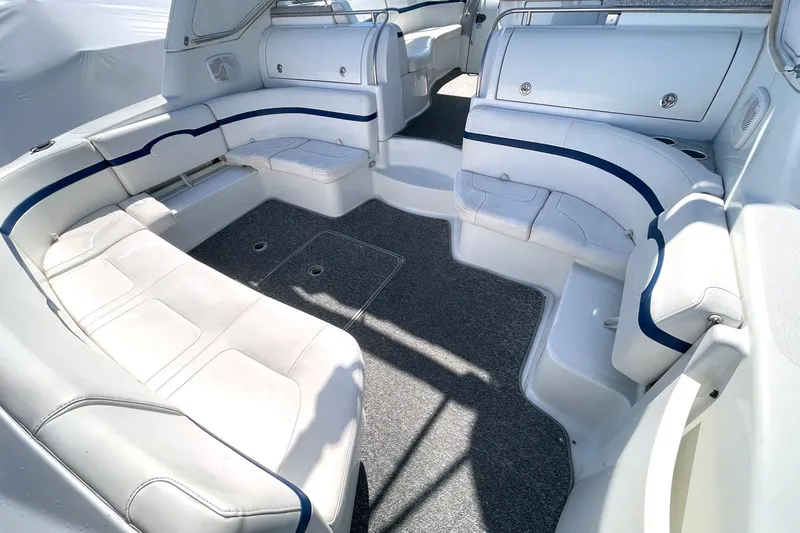 Slide: The Image of Luxurious interior of 2005 Formula 48 Yacht with white seating and blue accents. - 4