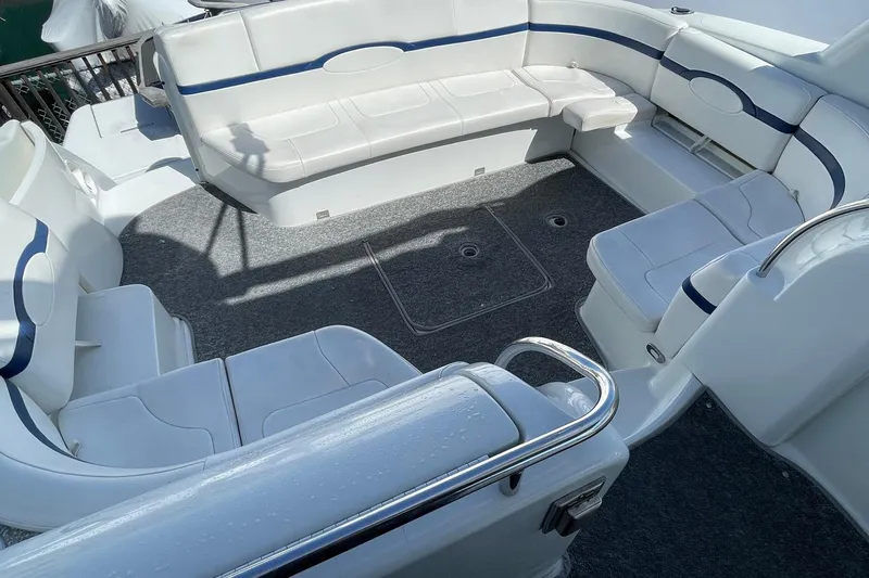 Slide: The Image of Spacious seating area on a 2005 Formula 48 Yacht with white and blue upholstery. - 5