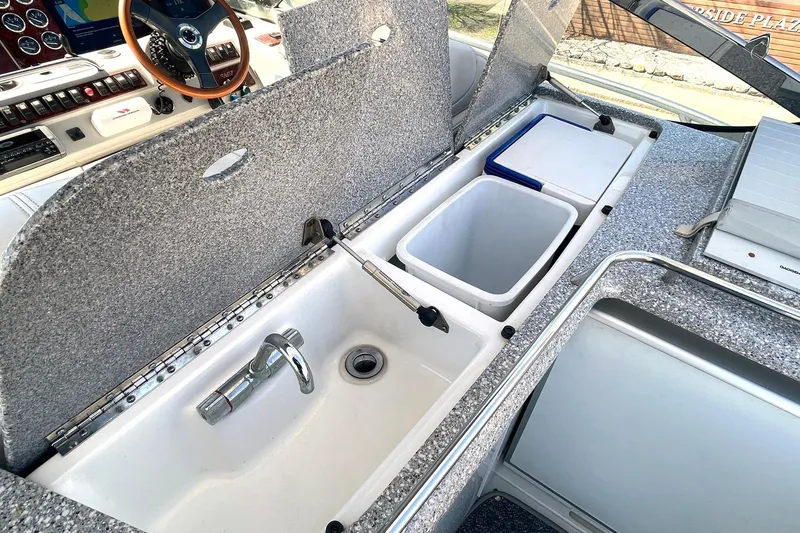 Slide: The Image of 2005 Formula 48 Yacht interior with sink, faucet, and storage compartments. - 6