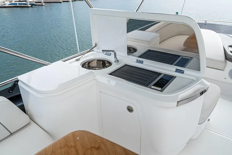 Slide: The Image of Outdoor kitchen area on 2024 Princess F45 yacht with sink and grill. - 19