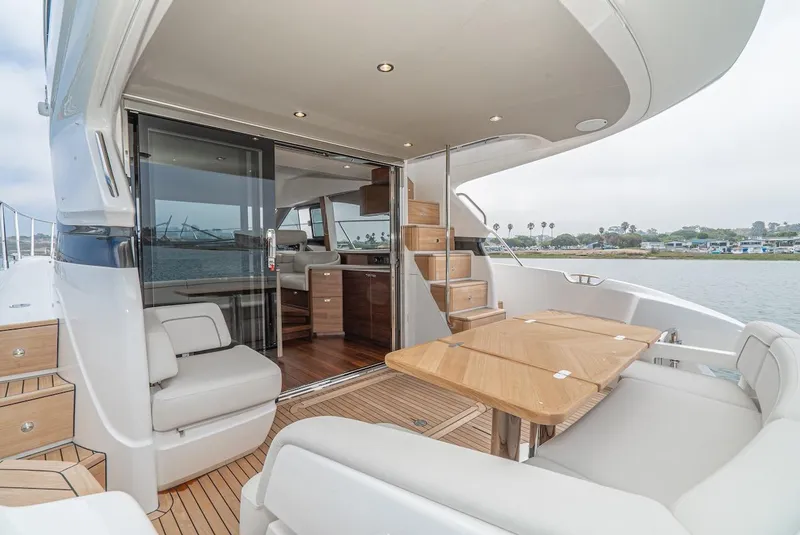 Slide: The Image of 2024 Princess F45 yacht interior with modern seating and dining area. - 21