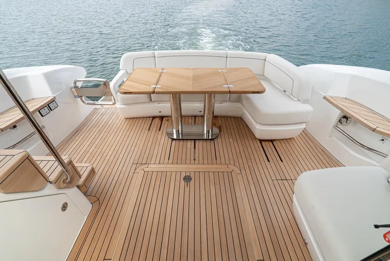Slide: The Image of 2024 Princess F45 yacht with teak deck and elegant seating area. - 23