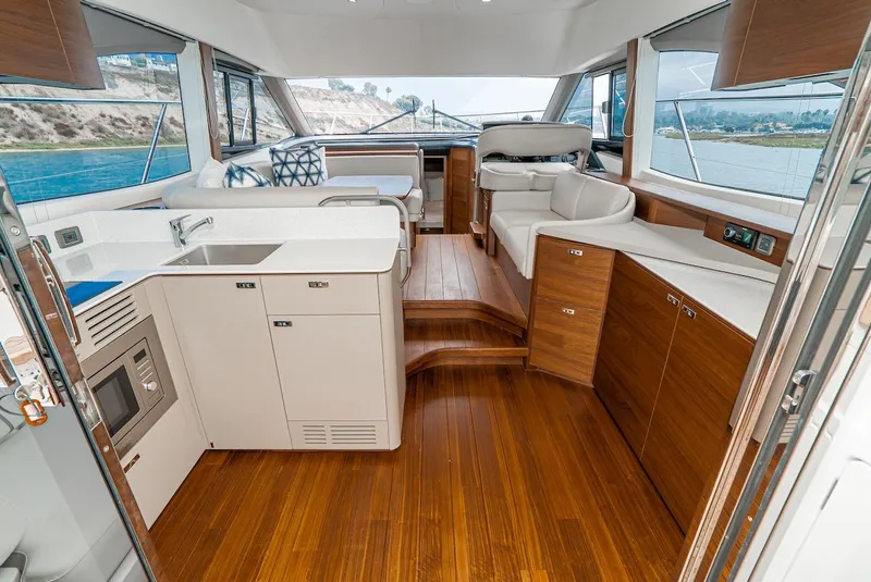 Slide: The Image of Luxurious interior of 2024 Princess F45 yacht with modern kitchen and seating area. - 25