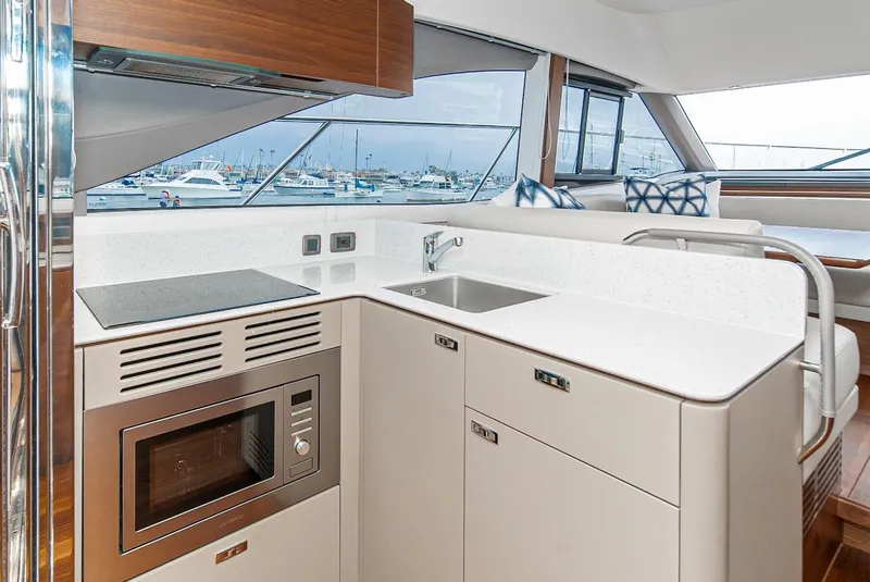 Slide: The Image of Modern kitchen area on the 2024 Princess F45 yacht with sleek appliances. - 28