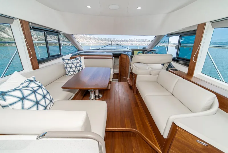 Slide: The Image of Luxurious interior of the 2024 Princess F45 yacht with elegant seating and wooden finishes. - 29