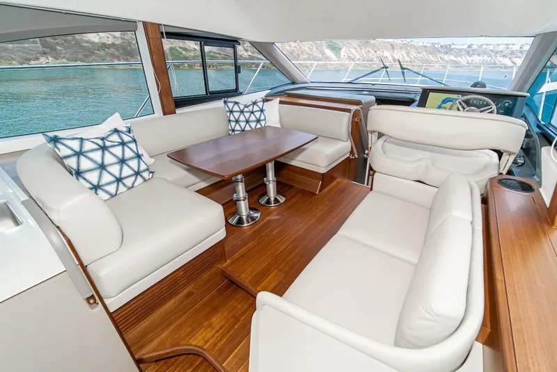 Slide: The Image of Luxurious interior of the 2024 Princess F45 yacht with elegant seating and wooden table. - 30