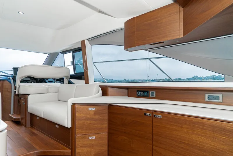 Slide: The Image of 2024 Princess F45 yacht interior with modern wood cabinetry and white seating. - 32