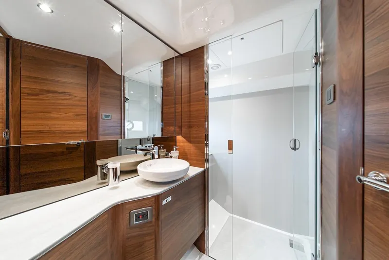 Slide: The Image of Luxurious bathroom in 2024 Princess F45 yacht with wooden cabinetry and glass shower. - 37