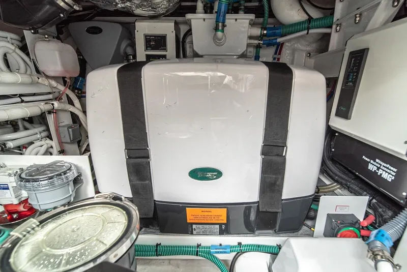 Slide: The Image of Engine room of a 2024 Princess F45 yacht with various mechanical components. - 48