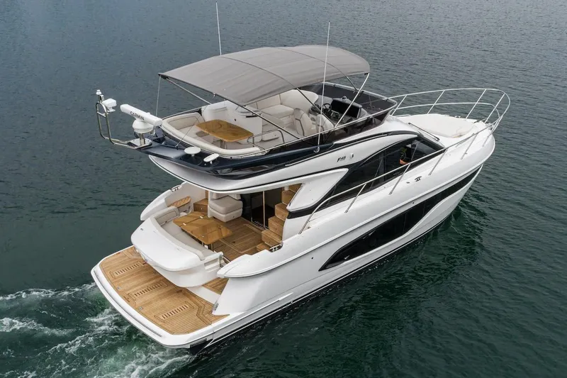 Slide: The Image of 2024 Princess F45 yacht cruising on open water, showcasing luxurious design and spacious deck. - 9