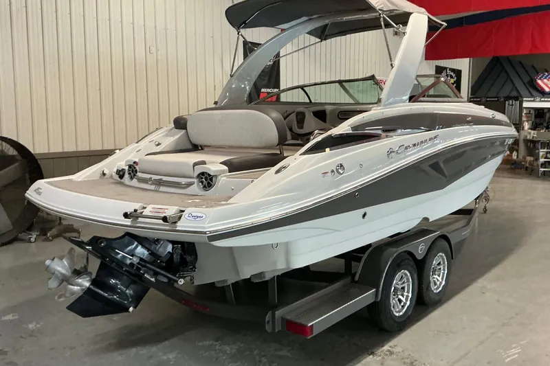 Slide: The Image of 2021 Crownline Eclipse E255 boat on trailer in indoor showroom. - 20