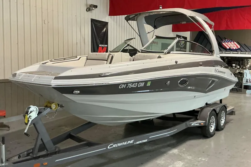 Slide: The Image of 2021 Crownline Eclipse E255 boat on trailer in indoor showroom. - 21
