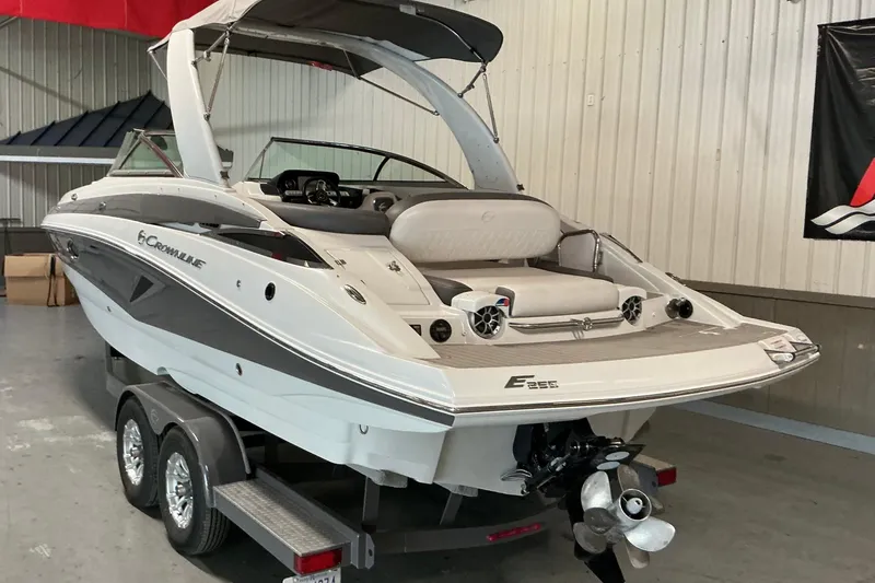 Slide: The Image of 2021 Crownline Eclipse E255 boat on trailer in indoor storage. - 22